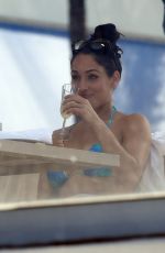 NIKKI BELLA in Bikini on the Set of Total Divas at a Pool in Miami 05/30/2018