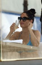 NIKKI BELLA in Bikini on the Set of Total Divas at a Pool in Miami 05/30/2018