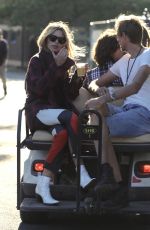 ABIGAIL ABBEY CLANCY and Peter Crouch at Golf Cart at Isle of Wight Festival 06/22/2018