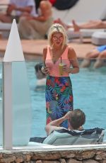 ASHLEY JAMES in Swimsuit at a Pool in Ibiza 06/06/2018
