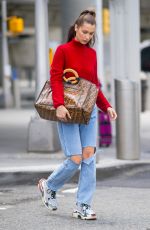 BELLA HADID in Ripped Jeans at JFK Airport in New York 06/02/2018