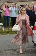 EMILIA CLARKE Arrives at Kit Harington and Rose Leslie