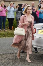 EMILIA CLARKE Arrives at Kit Harington and Rose Leslie