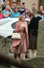 EMILIA CLARKE Arrives at Kit Harington and Rose Leslie