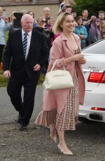 EMILIA CLARKE Arrives at Kit Harington and Rose Leslie