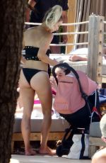 FERNE MCCANN in Bikini at Pool Club in Marbella 06/22/2018