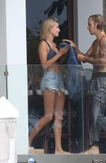 HAILEY BALDWIN and Justin Bieber on His Mansion Balcony in Miami 06/11/2018