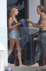 HAILEY BALDWIN and Justin Bieber on His Mansion Balcony in Miami 06/11/2018
