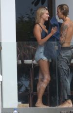 HAILEY BALDWIN and Justin Bieber on His Mansion Balcony in Miami 06/11/2018