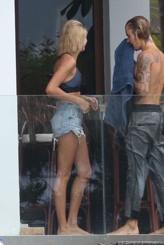 HAILEY BALDWIN and Justin Bieber on His Mansion Balcony in Miami 06/11/2018
