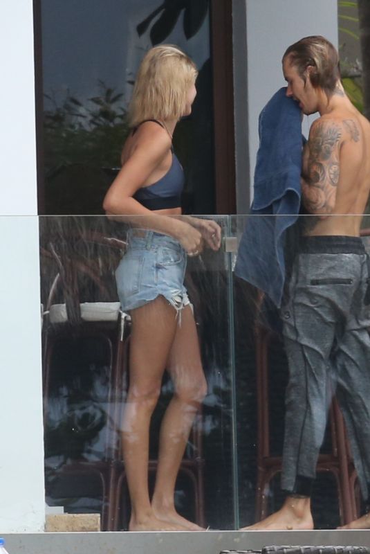 HAILEY BALDWIN and Justin Bieber on His Mansion Balcony in Miami 06/11/2018