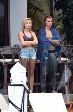 HAILEY BALDWIN and Justin Bieber on His Mansion Balcony in Miami 06/11/2018