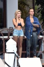 HAILEY BALDWIN and Justin Bieber on His Mansion Balcony in Miami 06/11/2018