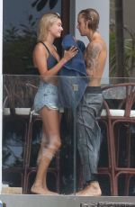 HAILEY BALDWIN and Justin Bieber on His Mansion Balcony in Miami 06/11/2018