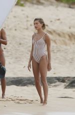 HAILEY BALDWIN in Swimsuit on the Set of a Photoshoot at a Beach in Hawaii 05/31/2018