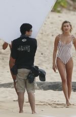 HAILEY BALDWIN in Swimsuit on the Set of a Photoshoot at a Beach in Hawaii 05/31/2018