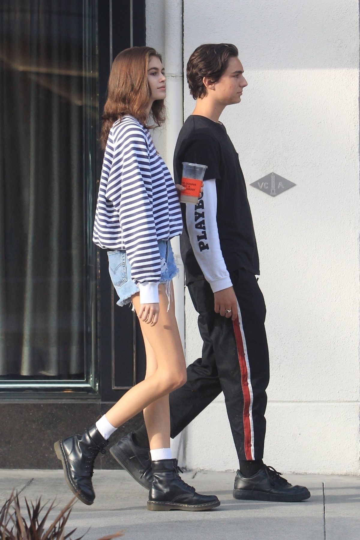 Kaia Gerber and Travis Jackson walking out in Los Angeles, with Kaia looking stylish in her outfit