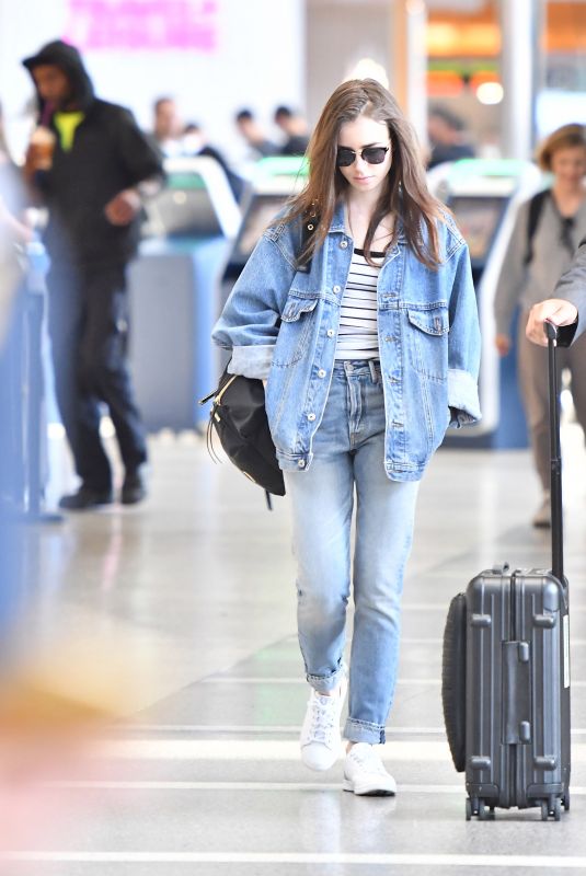 LILY COLLINS in Double Denim at LAX Airport in Los Angeles 06/04/2018
