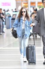 LILY COLLINS in Double Denim at LAX Airport in Los Angeles 06/04/2018