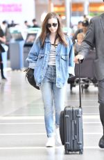 LILY COLLINS in Double Denim at LAX Airport in Los Angeles 06/04/2018