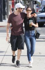LIZZY CAPLAN and Tom Riley Out Shopping in Beverly Hills 06/20/2018