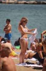 LOTTIE MOSS and TIN A STINNES in Bikinis at a Beach in Barcelona 06/13/2018