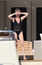 MELANIE GRIFFITH in Swimsuit at a Boat in Sardinia 06/20/2018