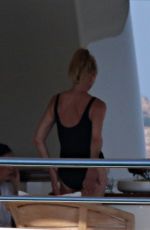 MELANIE GRIFFITH in Swimsuit at a Boat in Sardinia 06/20/2018