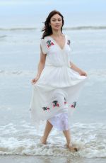 OLGA KURYLENKO on the Set of a Photoshoot in Cabourg 06/16/2018