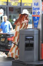 PHOEBE PRICE Digs in the Garbage at a Gas Station in Beverly Hills 06/22/2018