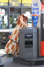 PHOEBE PRICE Digs in the Garbage at a Gas Station in Beverly Hills 06/22/2018