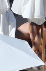 RITA ORA in Red Bikini at a Beach in Tuscany 06/05/2018