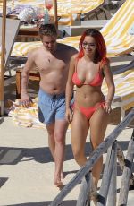 RITA ORA in Red Bikini at a Beach in Tuscany 06/05/2018