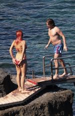 RITA ORA in Red Bikini at a Beach in Tuscany 06/05/2018