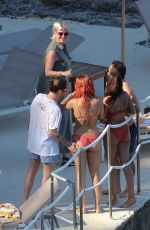 RITA ORA in Red Bikini at a Beach in Tuscany 06/05/2018