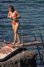RITA ORA in Red Bikini at a Beach in Tuscany 06/05/2018