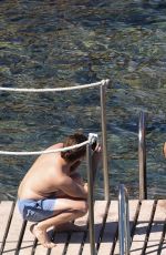 RITA ORA in Red Bikini at a Beach in Tuscany 06/05/2018