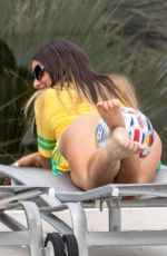 CLAUDIA ROMANI in a Brazil Jersey and Bikini Bottom at a Pool in Miami 07/01/2018