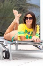 CLAUDIA ROMANI in a Brazil Jersey and Bikini Bottom at a Pool in Miami 07/01/2018