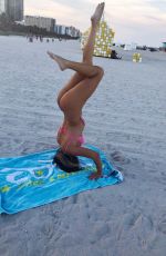 CLAUDIA ROMANI in Bikini Doing Yoga in South Beach 07/16/2018