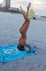 CLAUDIA ROMANI in Bikini Doing Yoga in South Beach 07/16/2018