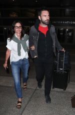 COURTENEY COX and Johnny McDaid at LAX Airport in Los Angeles 07/27/2018