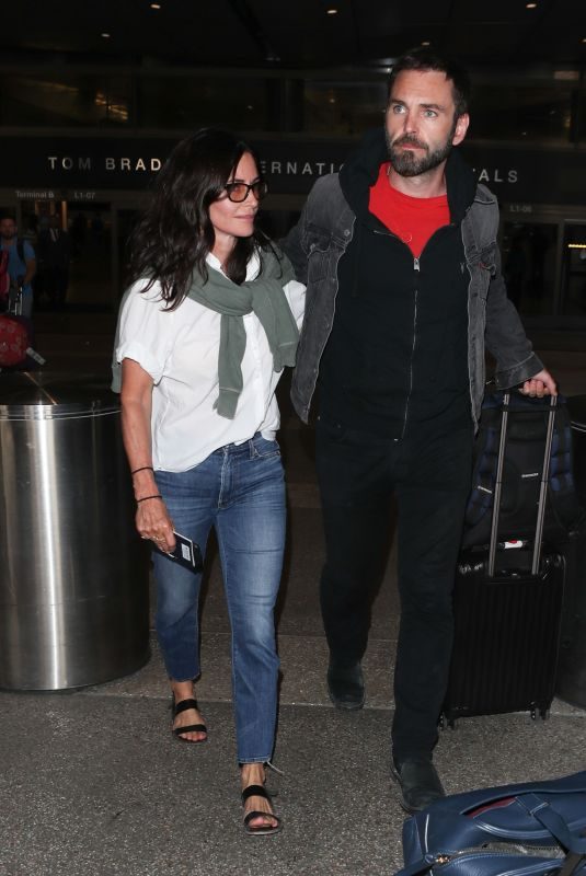 COURTENEY COX and Johnny McDaid at LAX Airport in Los Angeles 07/27/2018
