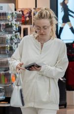 DAKOTA FANNING at Heathrow Airport in London 07/16/2018