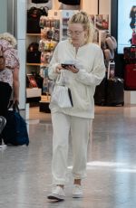 DAKOTA FANNING at Heathrow Airport in London 07/16/2018