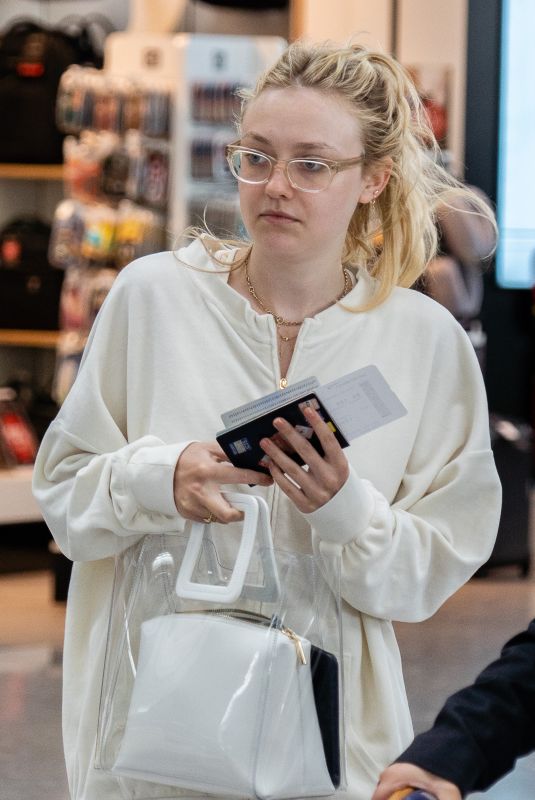 DAKOTA FANNING at Heathrow Airport in London 07/16/2018