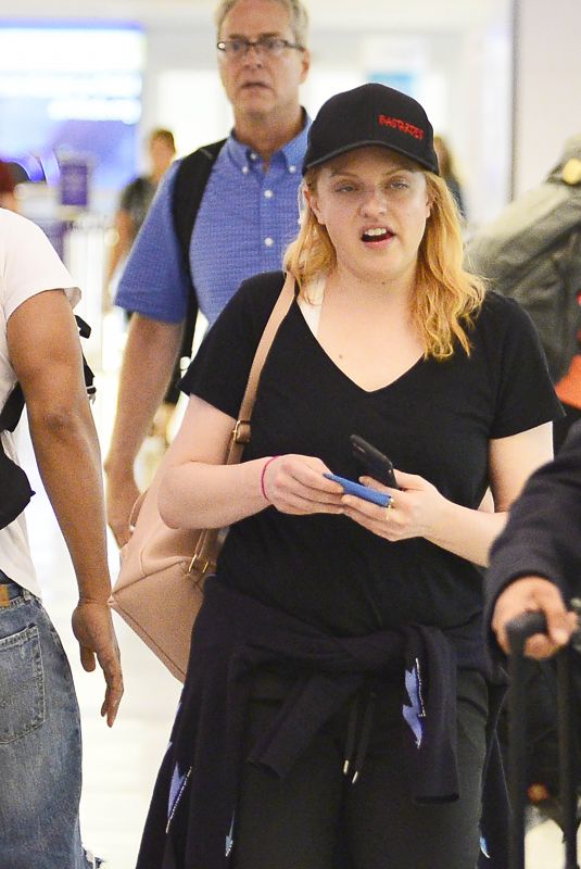 ELIZABETH MOSS at LAX Airport in Los Angeles 07/10/2018