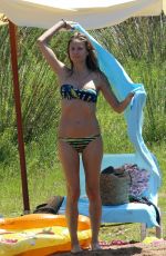 HEIDI KLUM in Bikini at a Beach in Corsica 07/25/2018