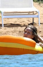HEIDI KLUM in Bikini at a Beach in Corsica 07/25/2018