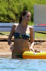 HEIDI KLUM in Bikini at a Beach in Corsica 07/25/2018